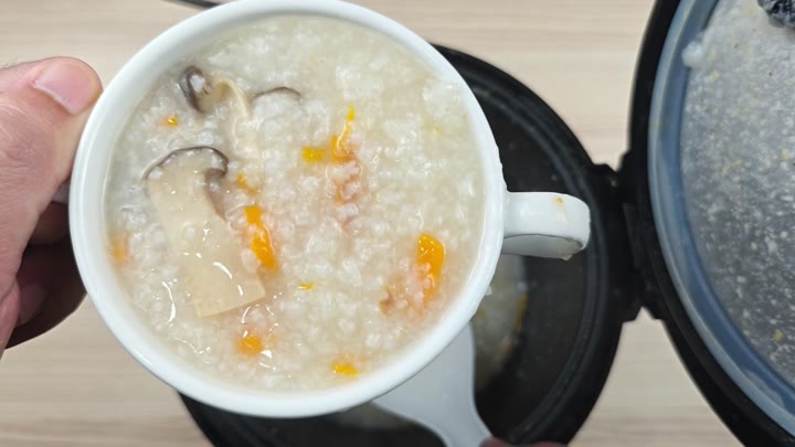 Finished congee in mug Finished congee in mug