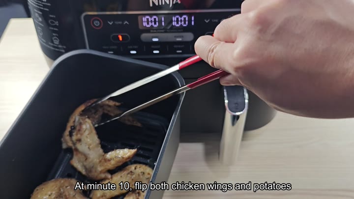 Flipping wings in the air fryer basket Flipping wings in the air fryer basket