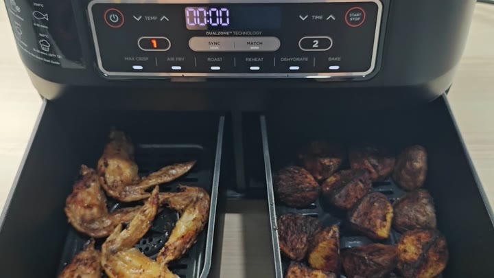 Golden wings and roasted potatoes cooked Golden wings and roasted potatoes cooked