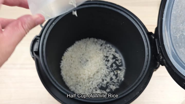 Half cup white rice in pot Half cup white rice in pot