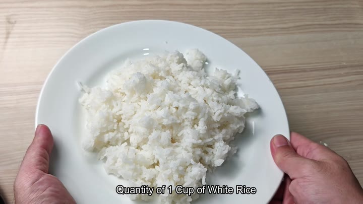 Plated serving of fluffy white rice Plated serving of fluffy white rice