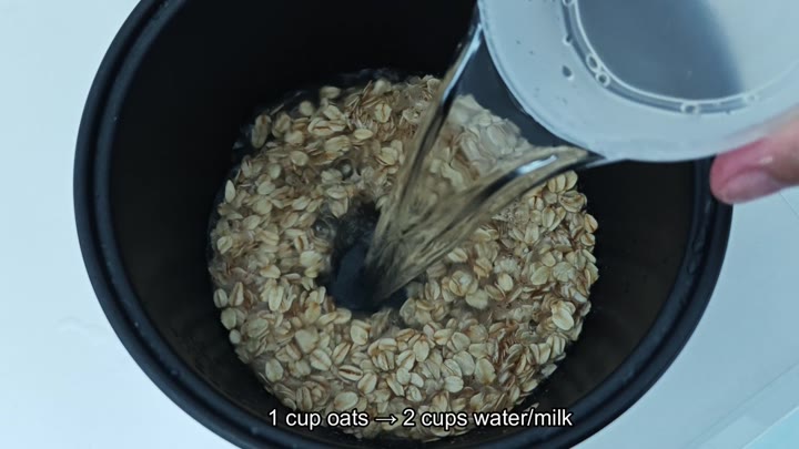 Pouring liquid into oats in pot Pouring liquid into oats in pot