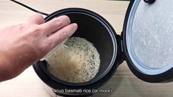 Pouring one cup of basmati rice Pouring one cup of basmati rice