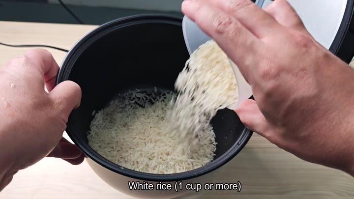 Pouring white rice into cooker pot Pouring white rice into cooker pot