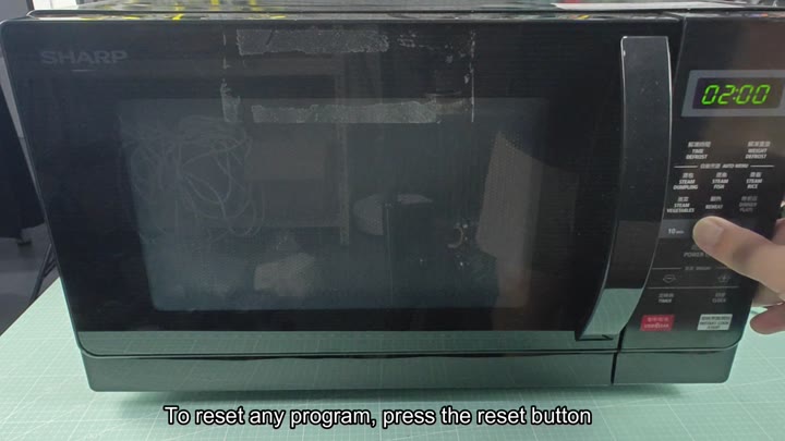 Pressing buttons on Sharp microwave panel Pressing buttons on Sharp microwave panel