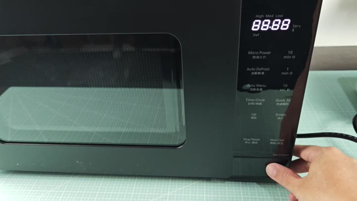 Pressing start button on Panasonic microwave Pressing start button on Panasonic microwave