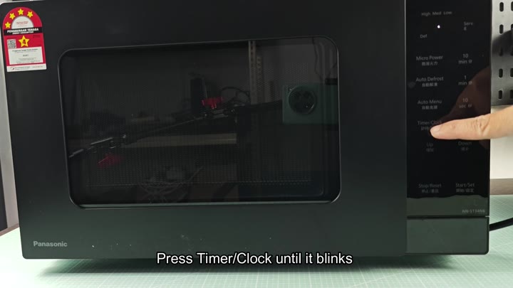 Pressing Timer Clock button on Panasonic Pressing Timer Clock button on Panasonic