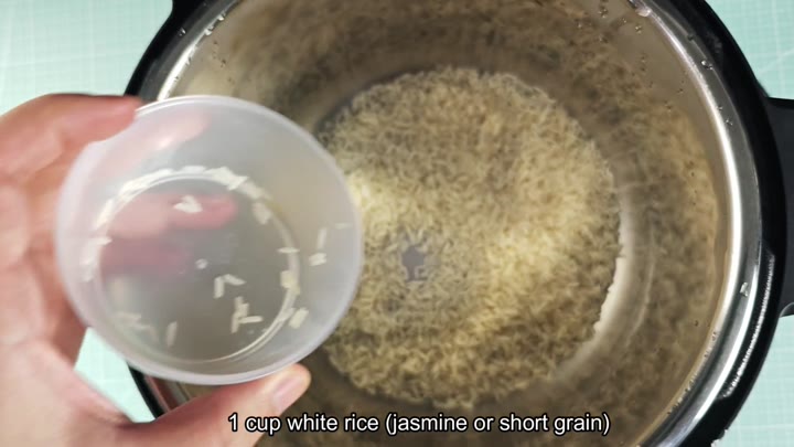 Rice added to pressure cooker pot Rice added to pressure cooker pot