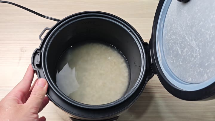 Rice submerged in water inside pot Rice submerged in water inside pot