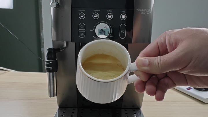 Rich espresso pouring from machine spouts Rich espresso pouring from machine spouts