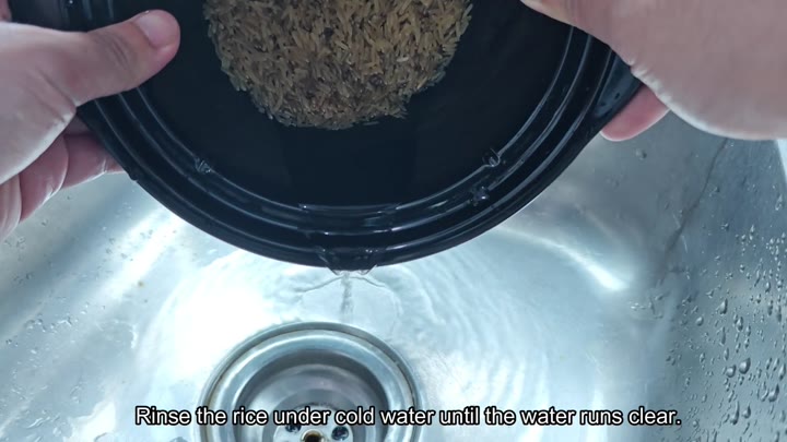 Rinsing brown rice until water runs clear Rinsing brown rice until water runs clear