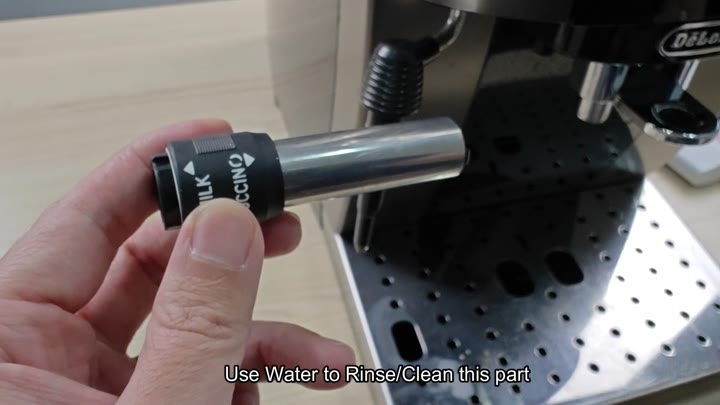 Rinsing steam wand with water Rinsing steam wand with water