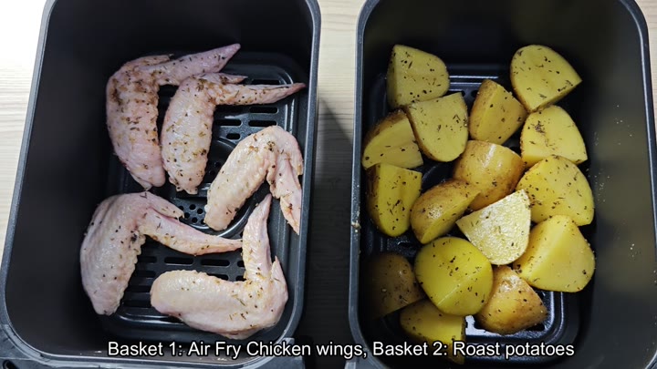 Seasoned wings and potatoes in baskets Seasoned wings and potatoes in baskets