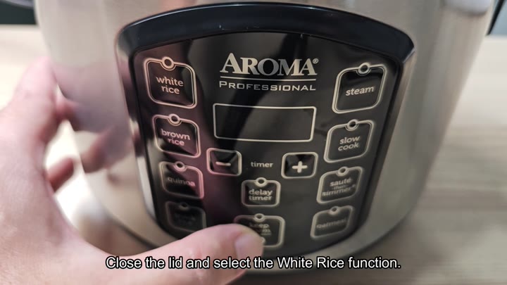 Selecting white rice function on panel Selecting white rice function on panel