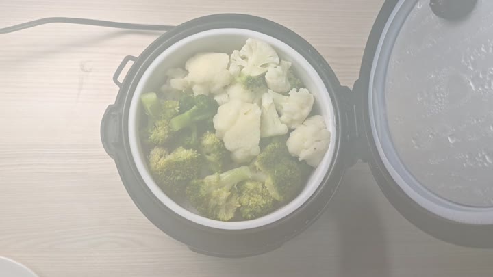 Steamed broccoli and cauliflower inside pot Steamed broccoli and cauliflower inside pot