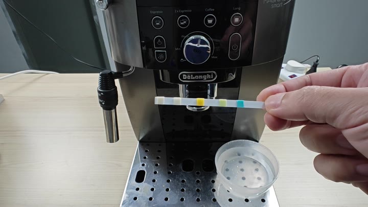 Test strip dipped in water sample Test strip dipped in water sample
