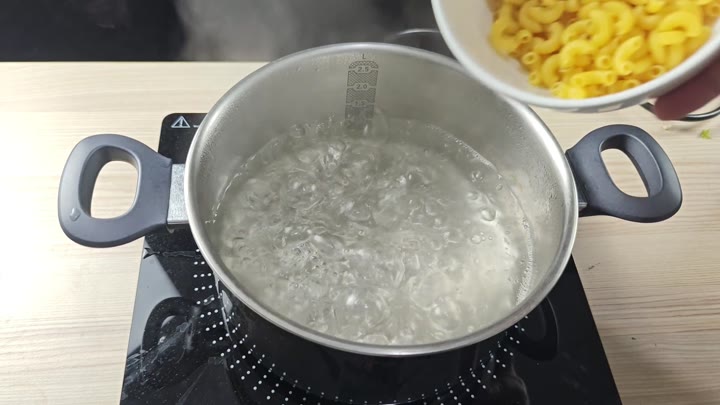 Uncooked macaroni ready for boiling water Uncooked macaroni ready for boiling water
