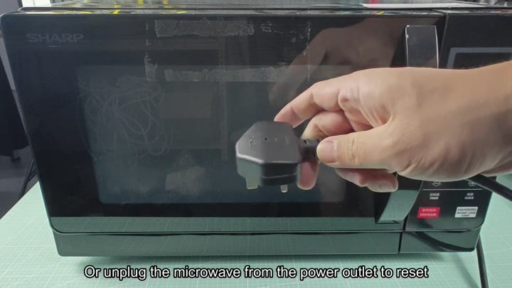 Unplugging Sharp microwave power cord Unplugging Sharp microwave power cord